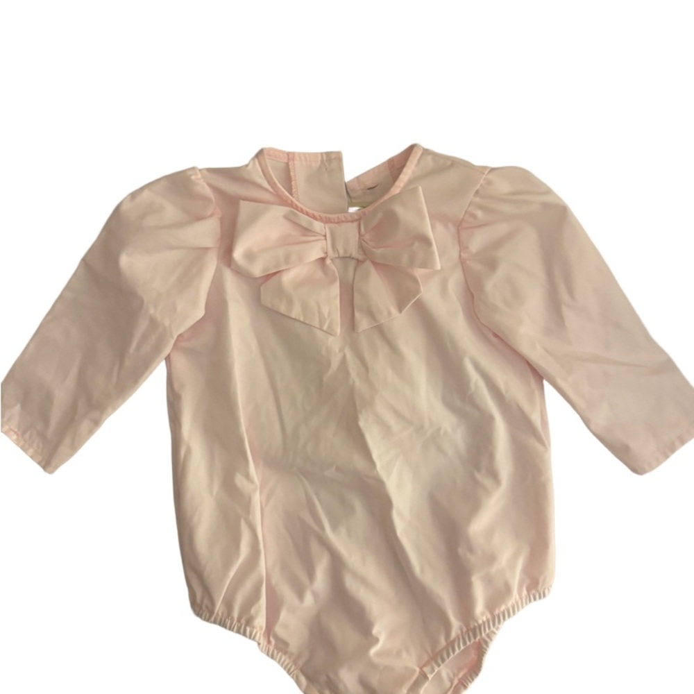 The Beaufort Bonnet company pink Beatrice bow onesie in palm beach pink